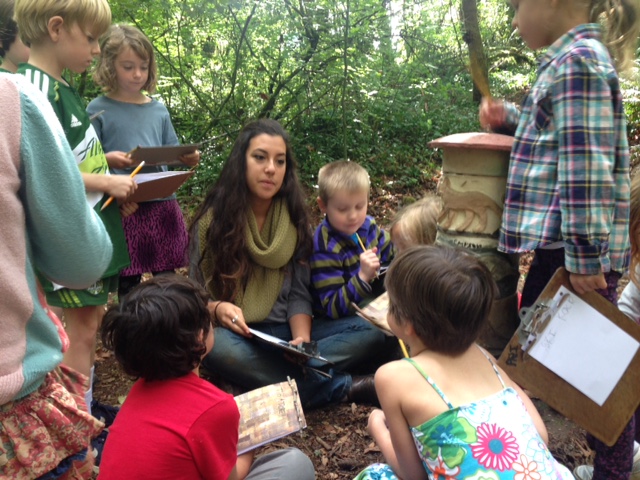 Danielle with her scientists in the Arbor woods.