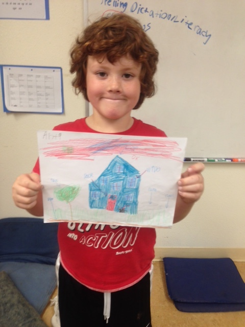 One of Elsie's 2nd graders with his labeled drawing of his house to send to his Panama pen pals.