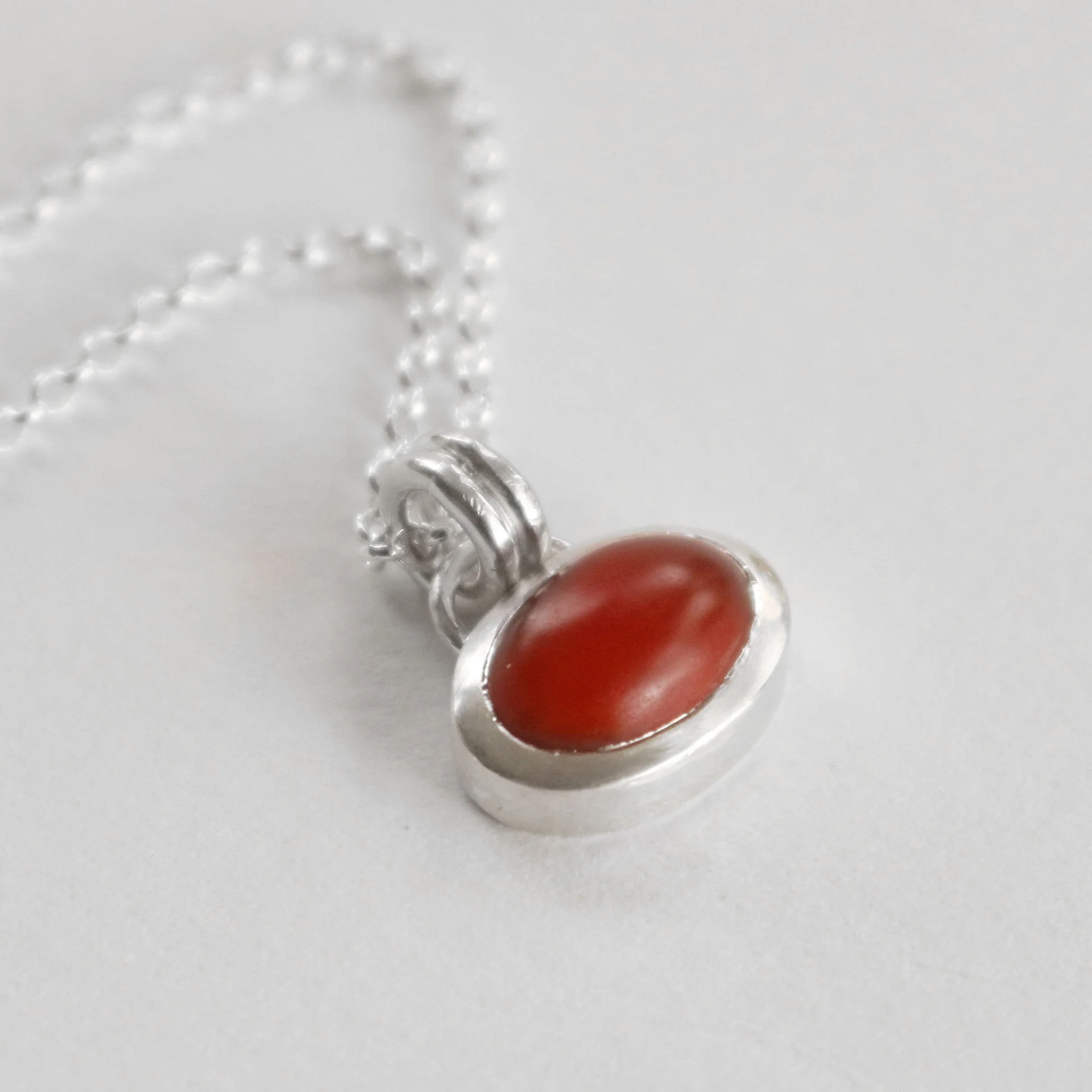 Red oval carnelian silver pendant.jpg
