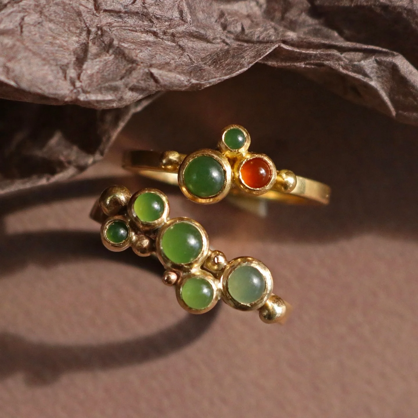 Saving my favourite ring of the collection for last!

Its sprinkling of Pounamu stones and little gold granules reminds me of the frothy sea-foam ebbing and flowing with the tides.

In the first photo, the one on the bottom is 9ct gold with 4 West Co