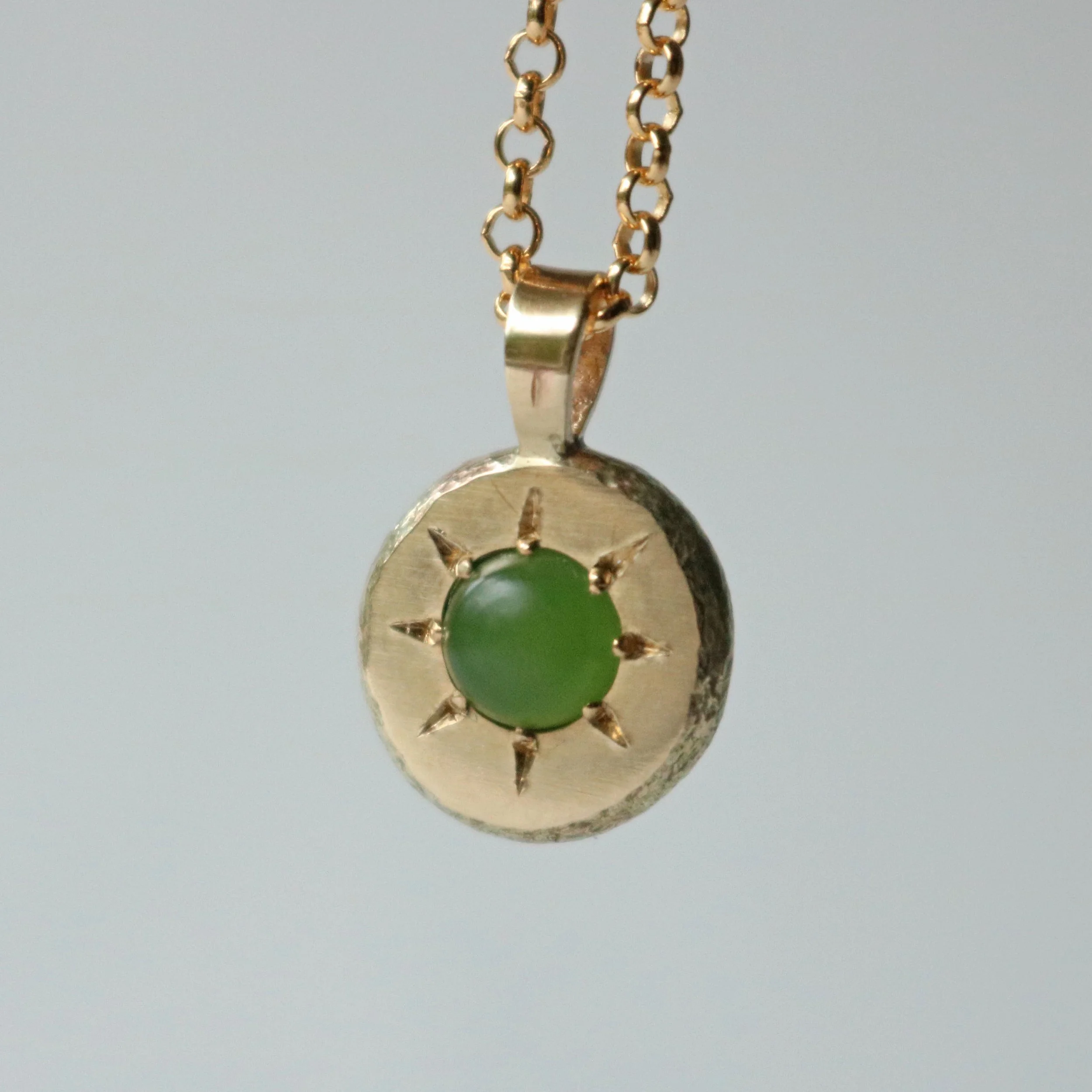 Pounamu sun pendant 2.jpg