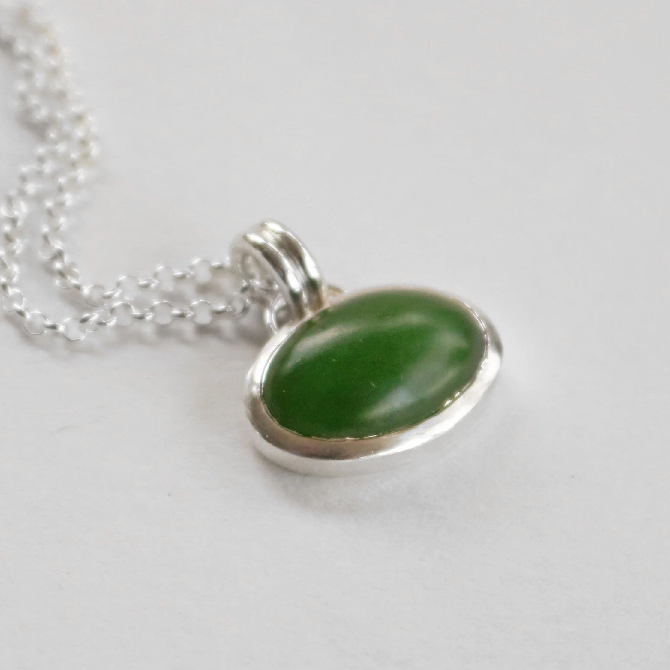 Pounamu oval silver pendant.jpg