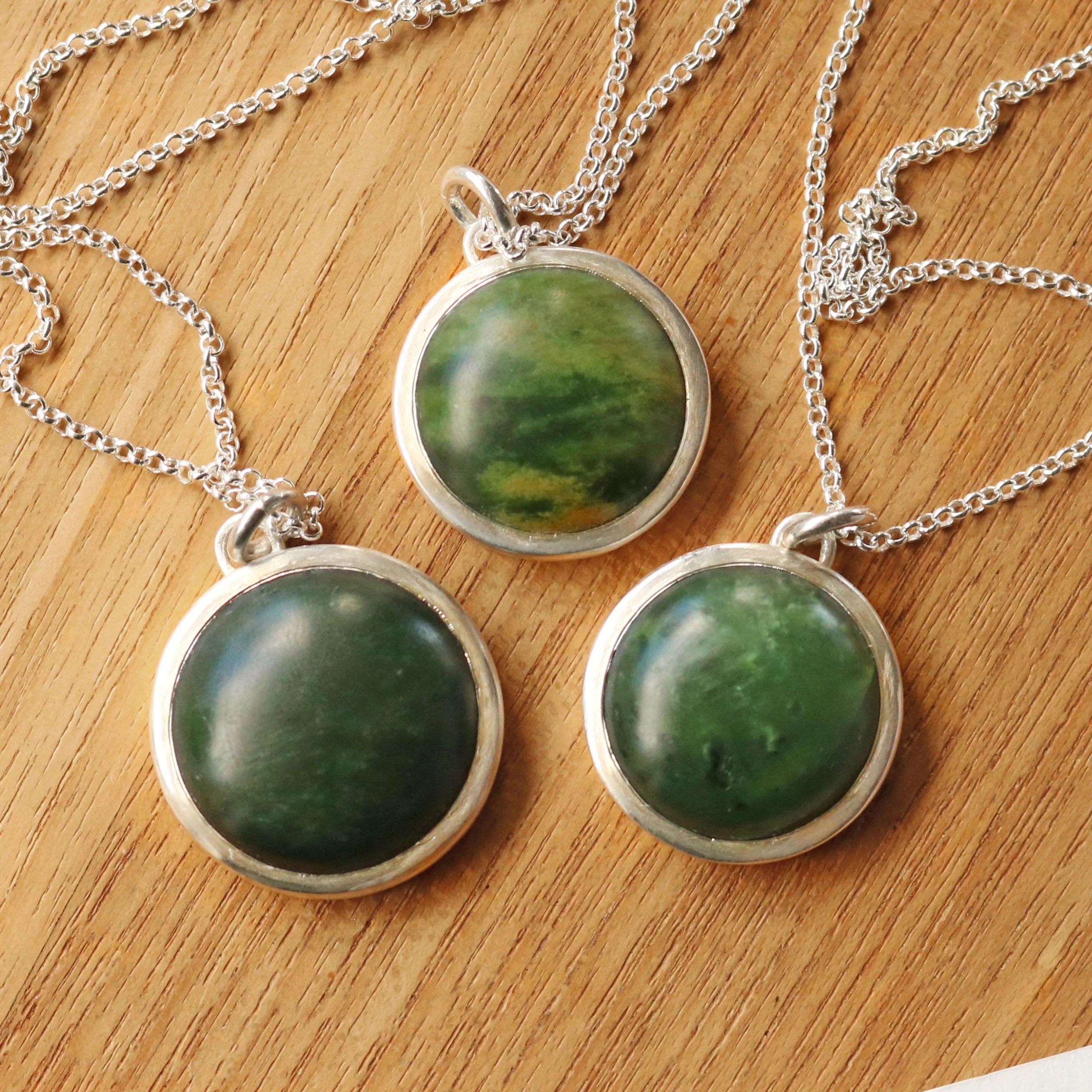 Silver Pounamu round pendants.jpg
