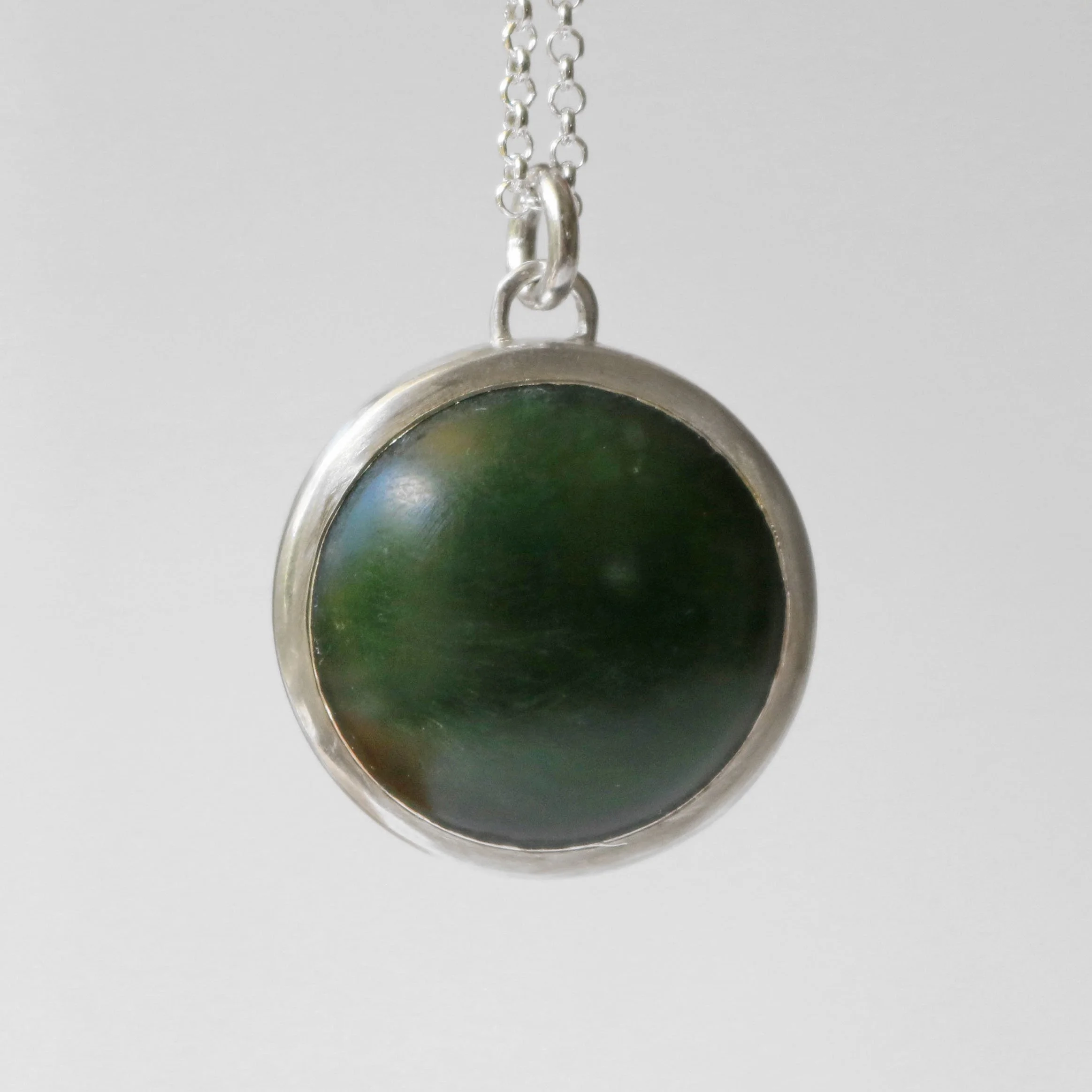 Dark pounamu silver round pendant 3.jpg