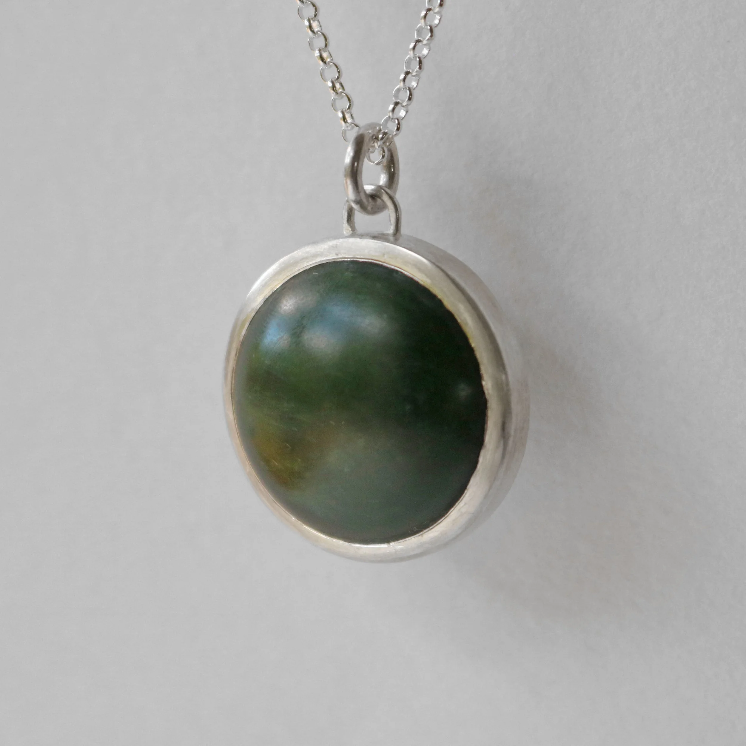 Dark pounamu silver round pendant 4.jpg