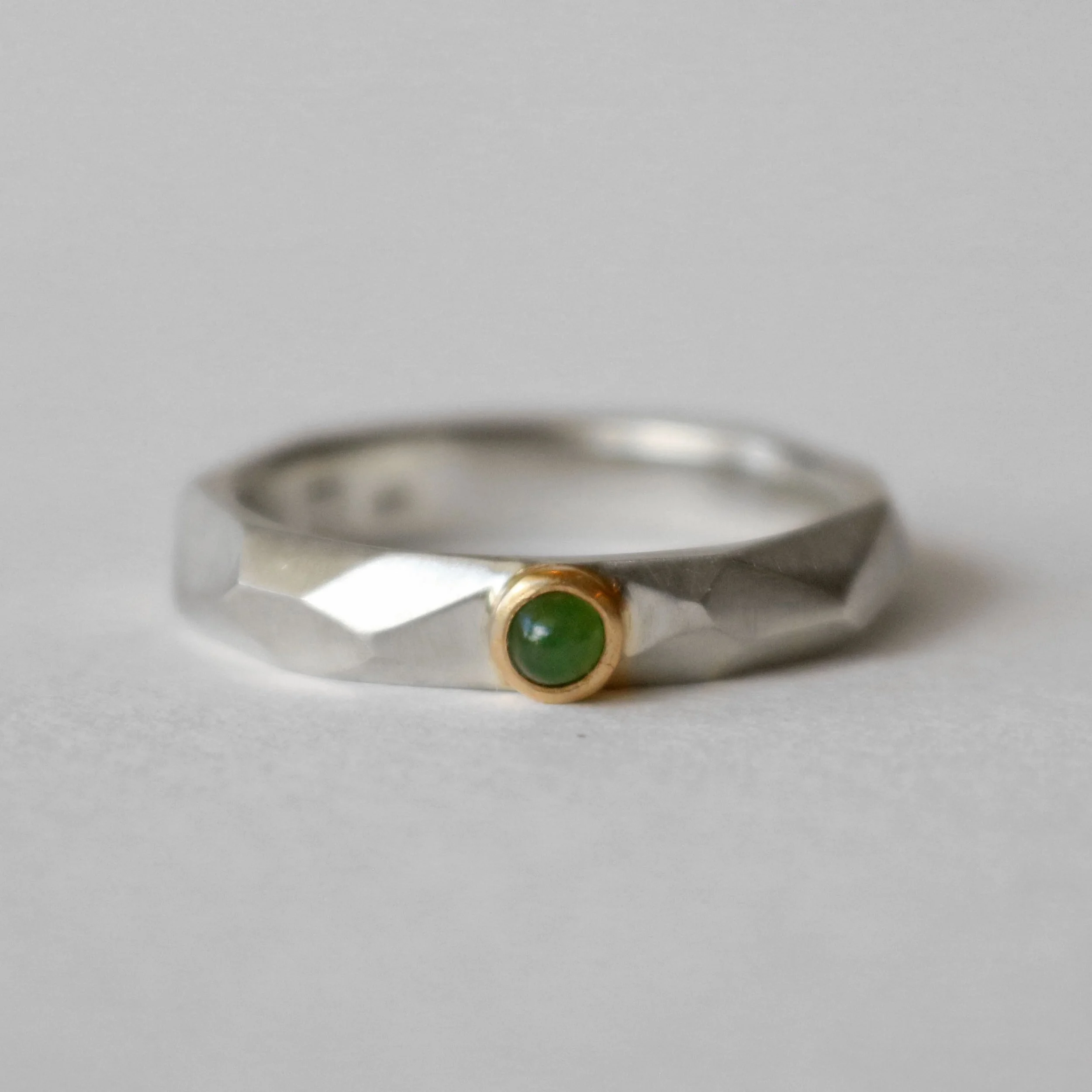 Irregular faceted silver Pounamu ring.jpg