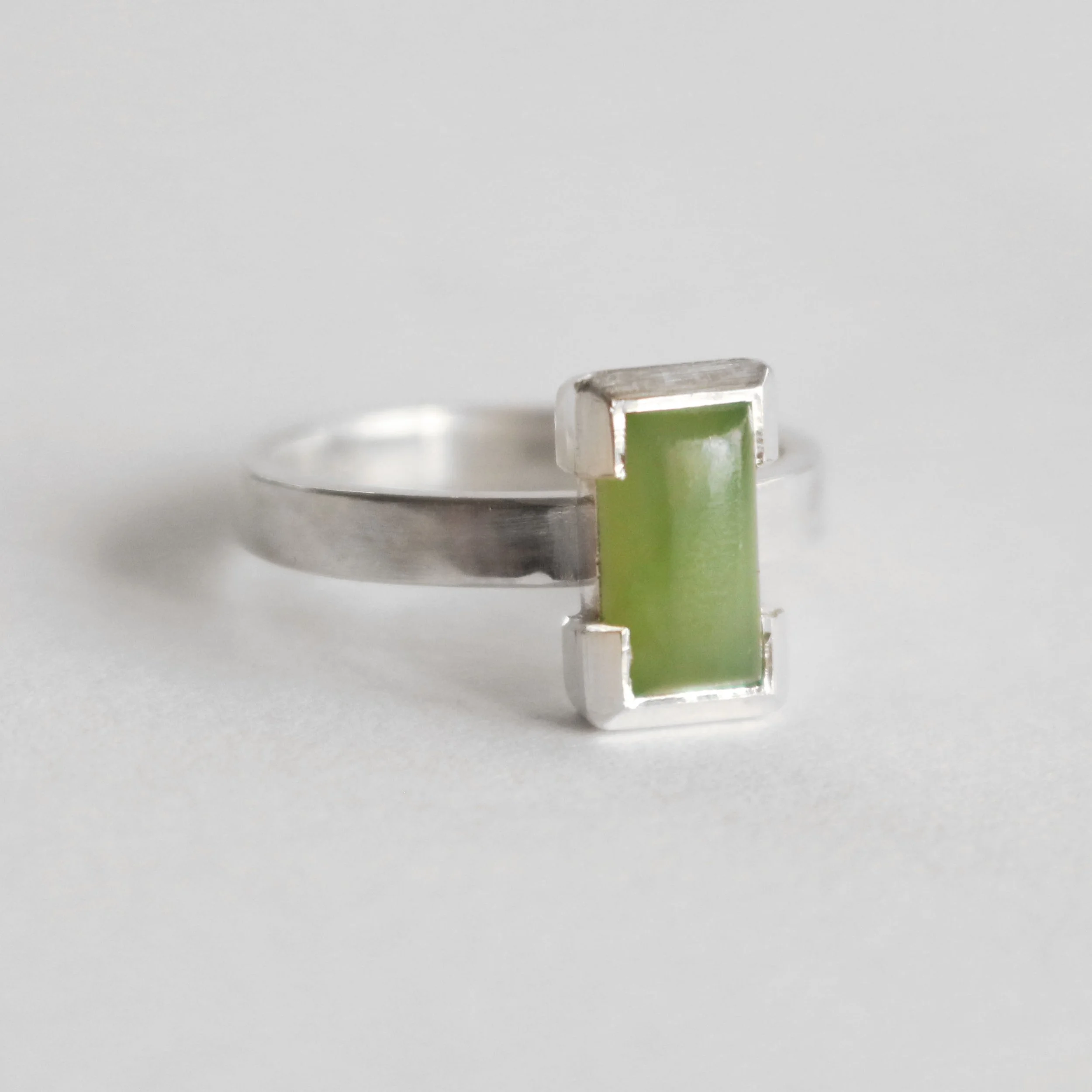 inanga pounamu rectangle silver ring.jpg