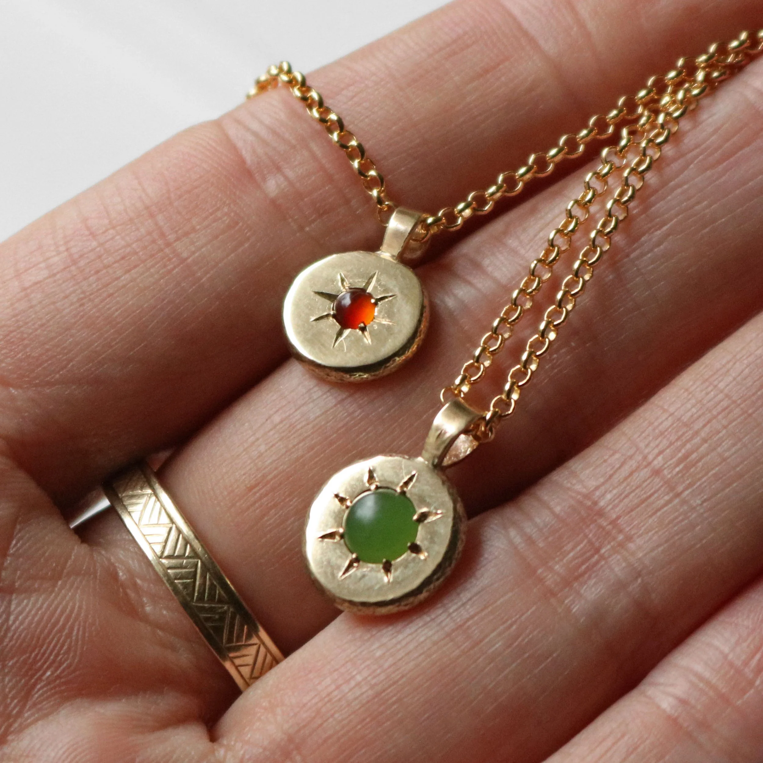Pounamu + carnelian sun pendants.jpg