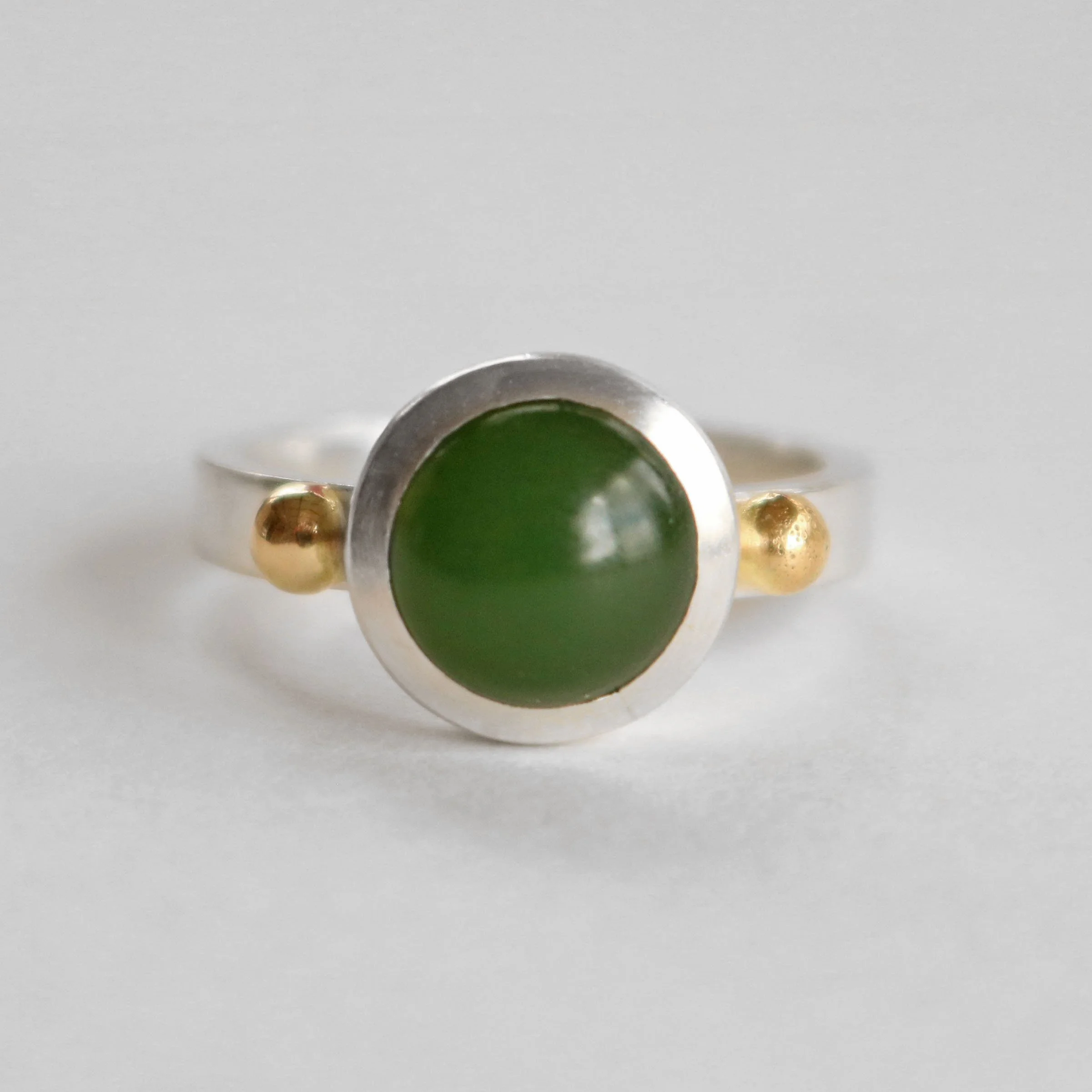 Round pounamu silver 18ct gold ring.jpg