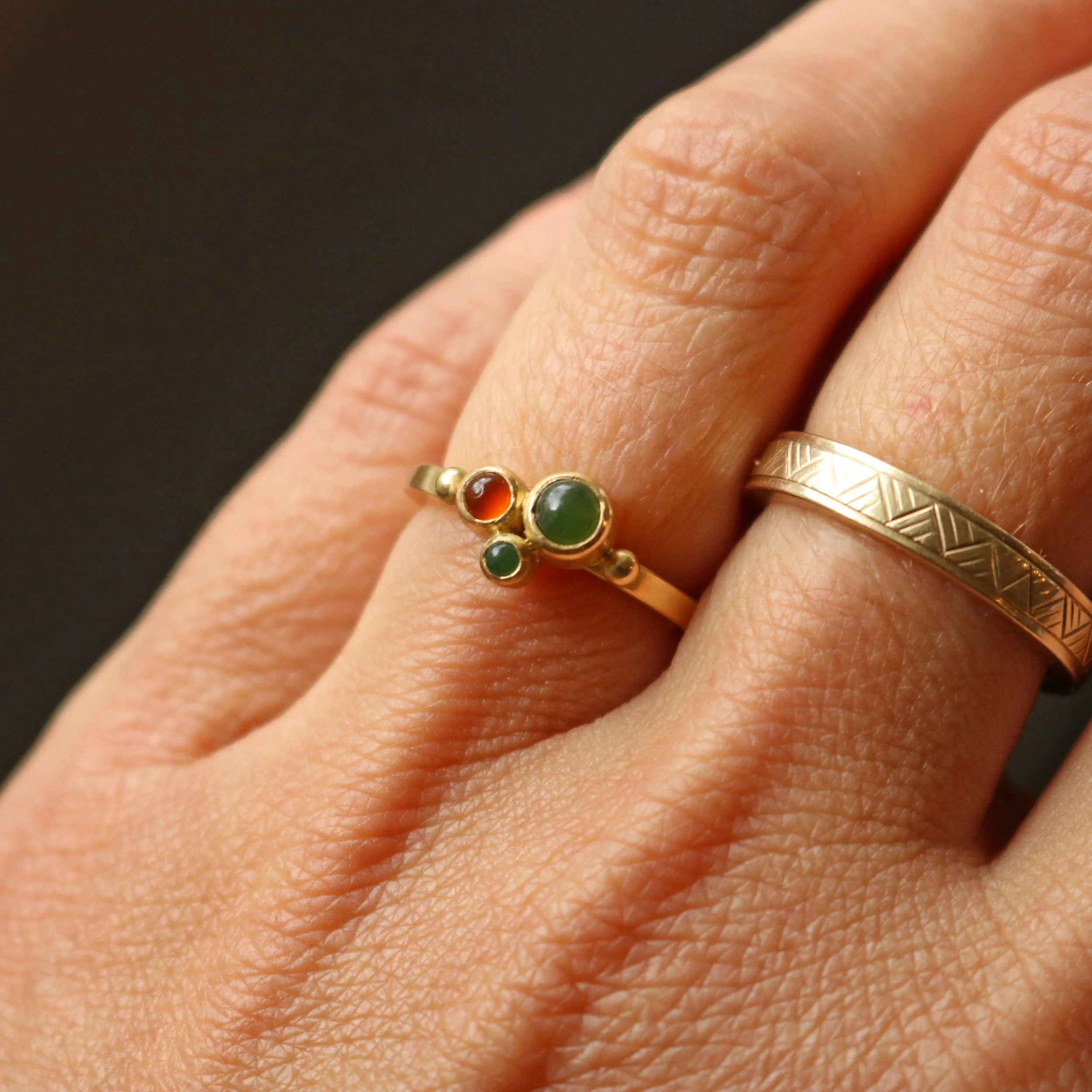 Granule pounamu + carnelian ring.jpg