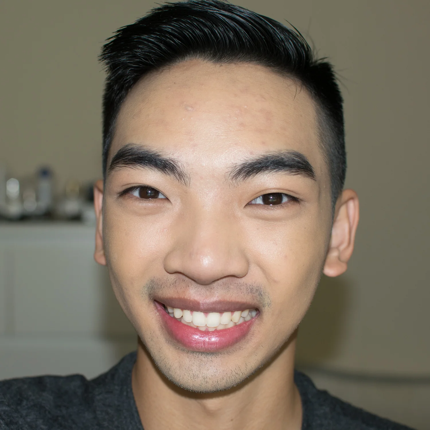 Only foundation and concealer applied, with flash