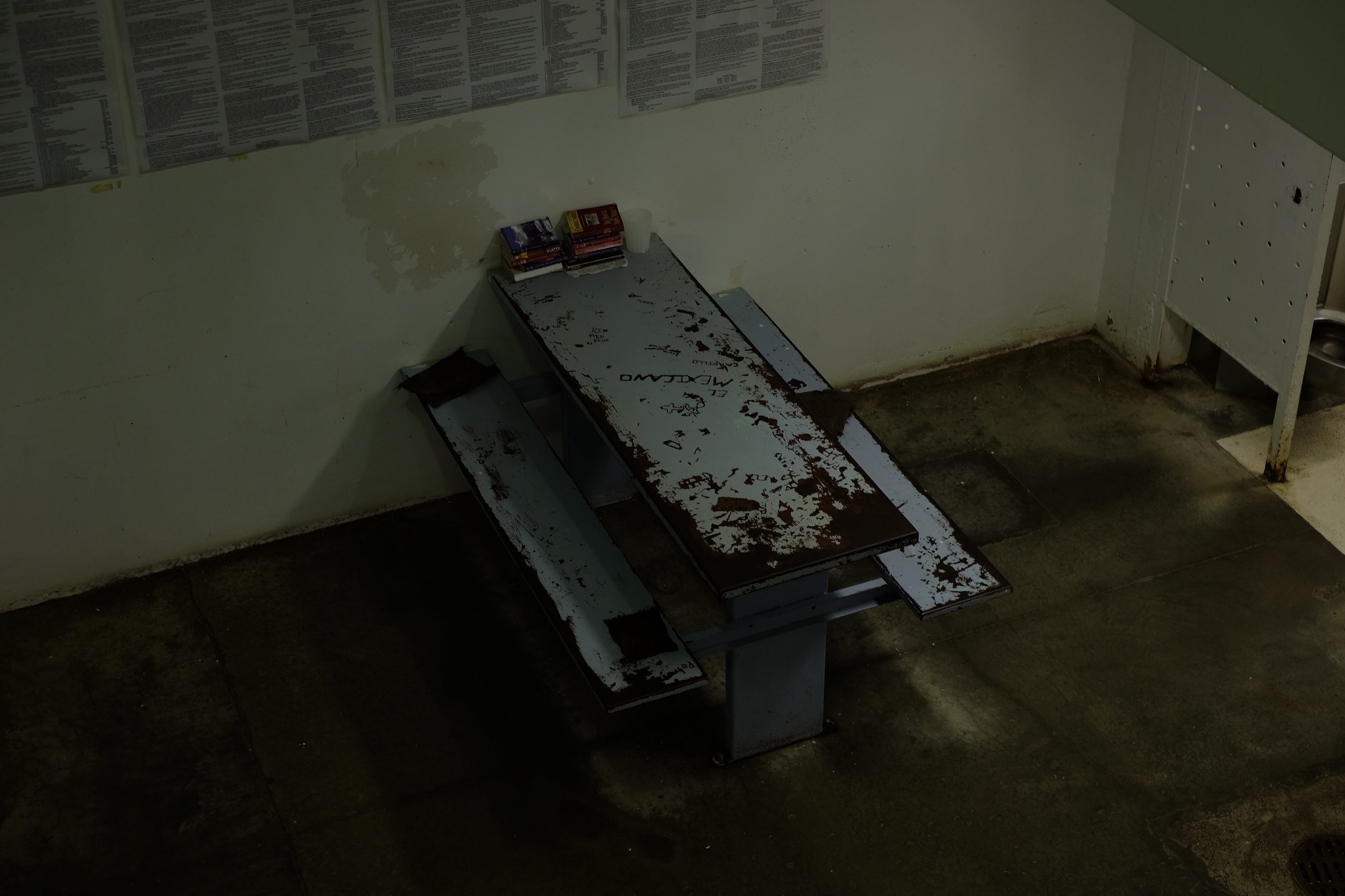  "El Mexicano" is carved into a table in c-block, one of the all-female dorms. The flaking paint on the tables smells and has been giving the inmates headaches, the women said. Christmas Day, 2015. 
