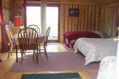  Inside the Loon Cabin The Homestead Cabin also has a deck overlooking a small pond. The Homestead has a Queen bed and a bunk bed. wood heat