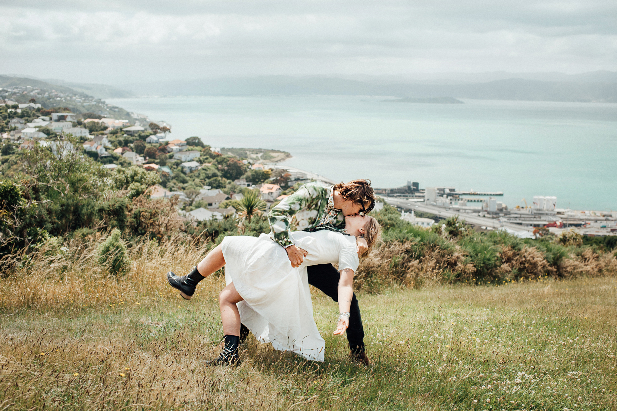 Wedding photography Wellington hilltop ceremony kiss