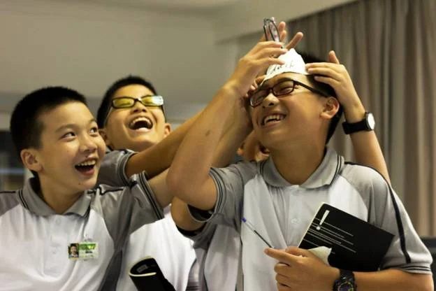  A game of “heads up” brings smiles all around.