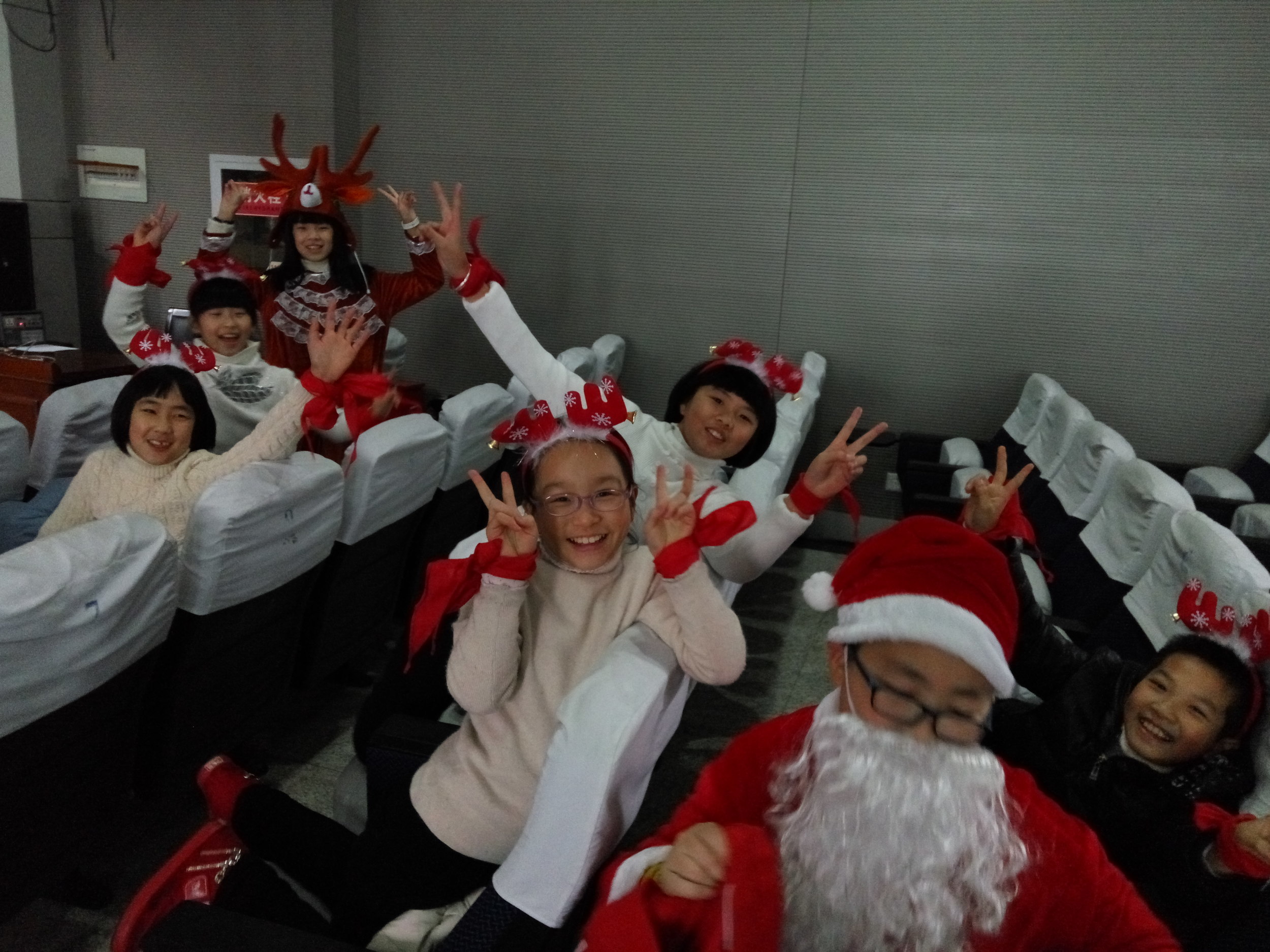 This is my fifth grade English club just before going on to give a Christmas show we rehearsed.