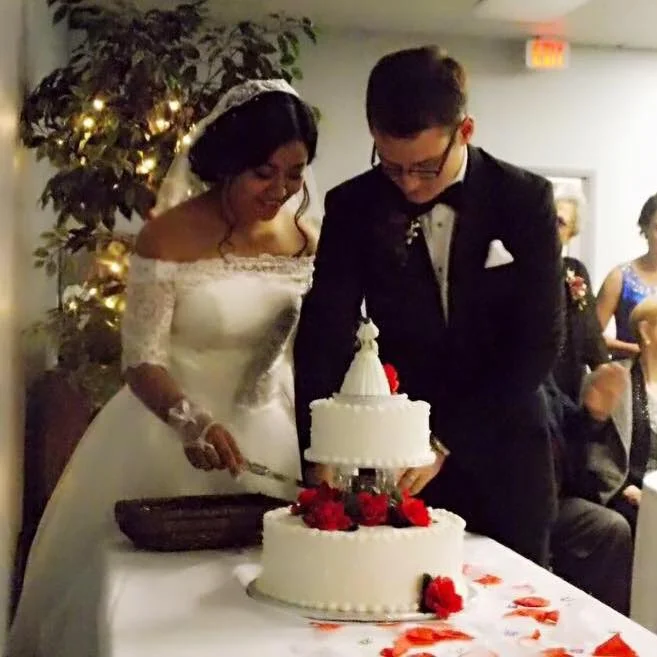 Seth and his bride cut the cake. C/o Seth.