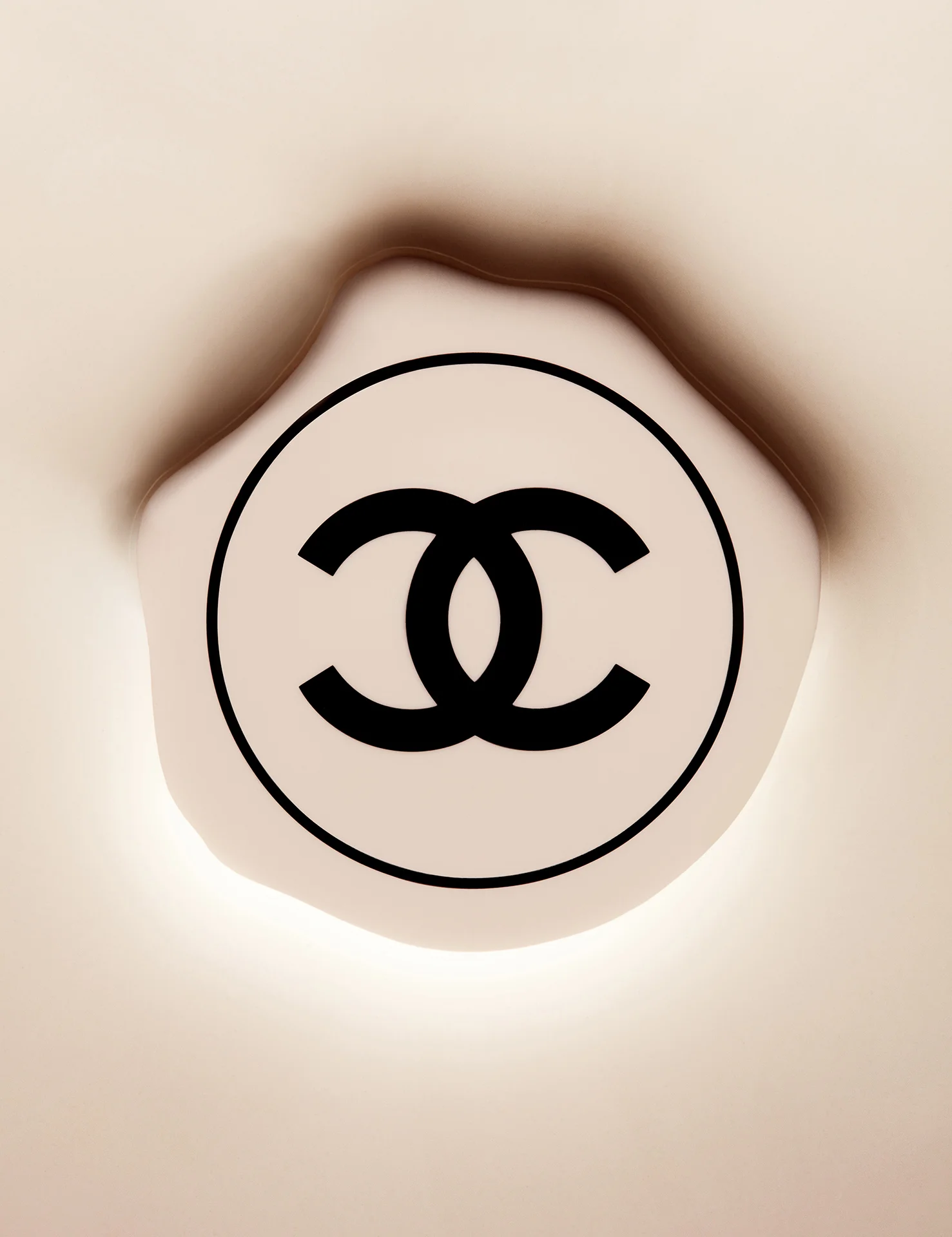  Chanel cosmetics still life photography. Luxury product photography of Chanel logo shot by still life photographer in London Joshua Caudwell. Creative product photography with makeup and cosmetics. 