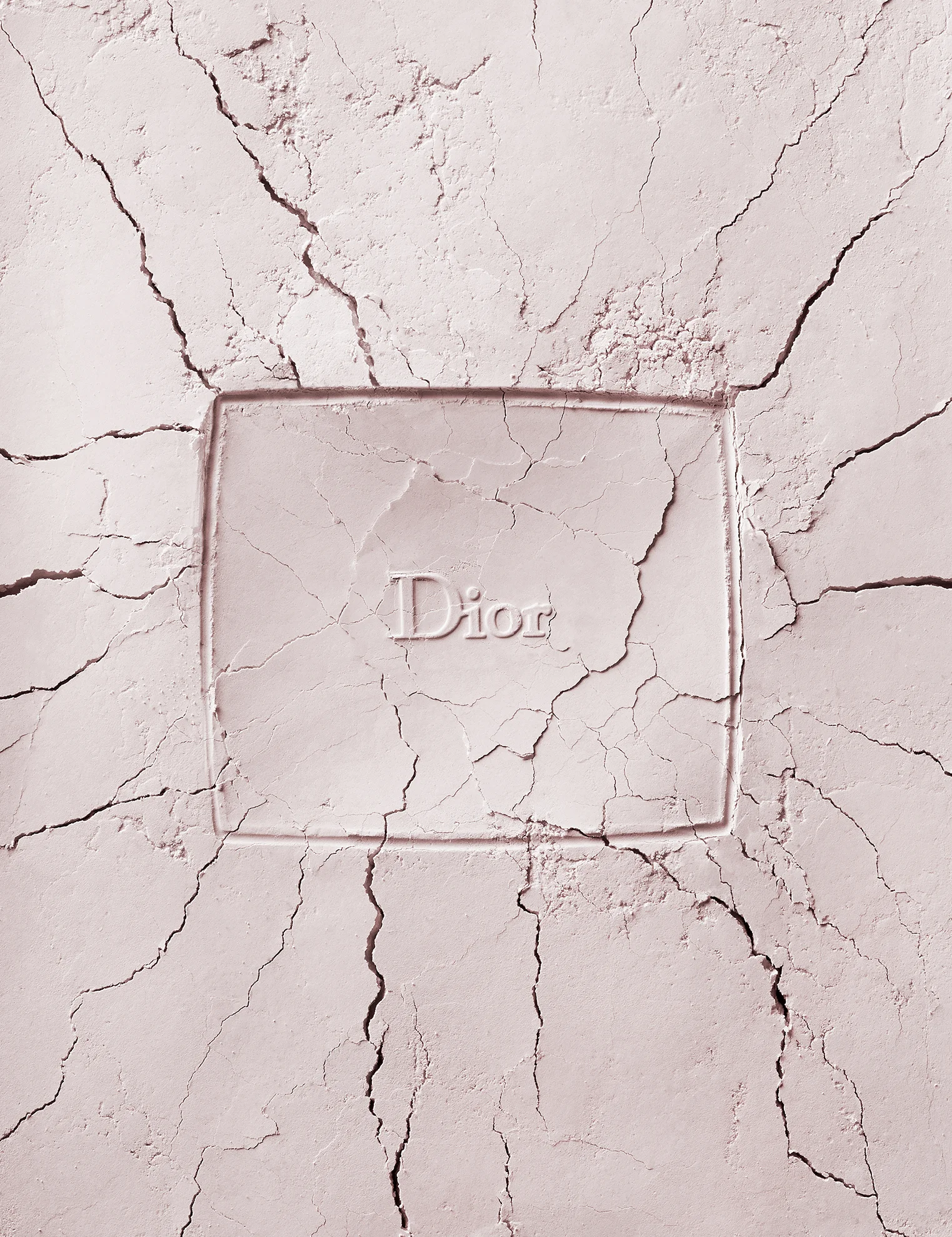  Dior cracked makeup powder imprint. Creative fashion still life photography of broken make up cosmetics.&nbsp;By luxury goods still life photographer,&nbsp;Josh Caudwell. For product and editorial photography in London, New York, Paris, Milan. 