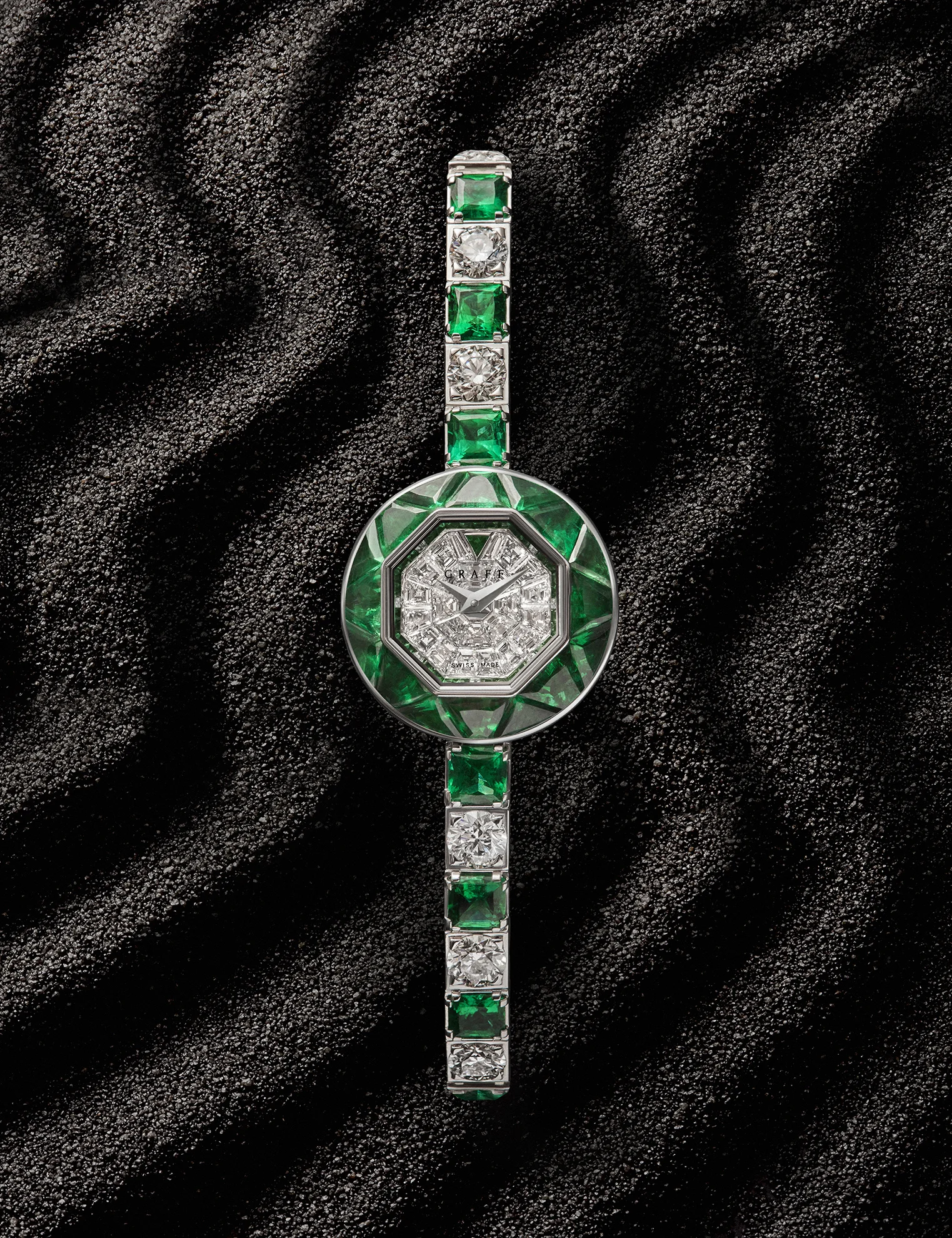  Still life photographer in London Joshua Caudwell shoots diamond and emerald Graff watch. Luxury product photography by watch photography Specialist in London. 