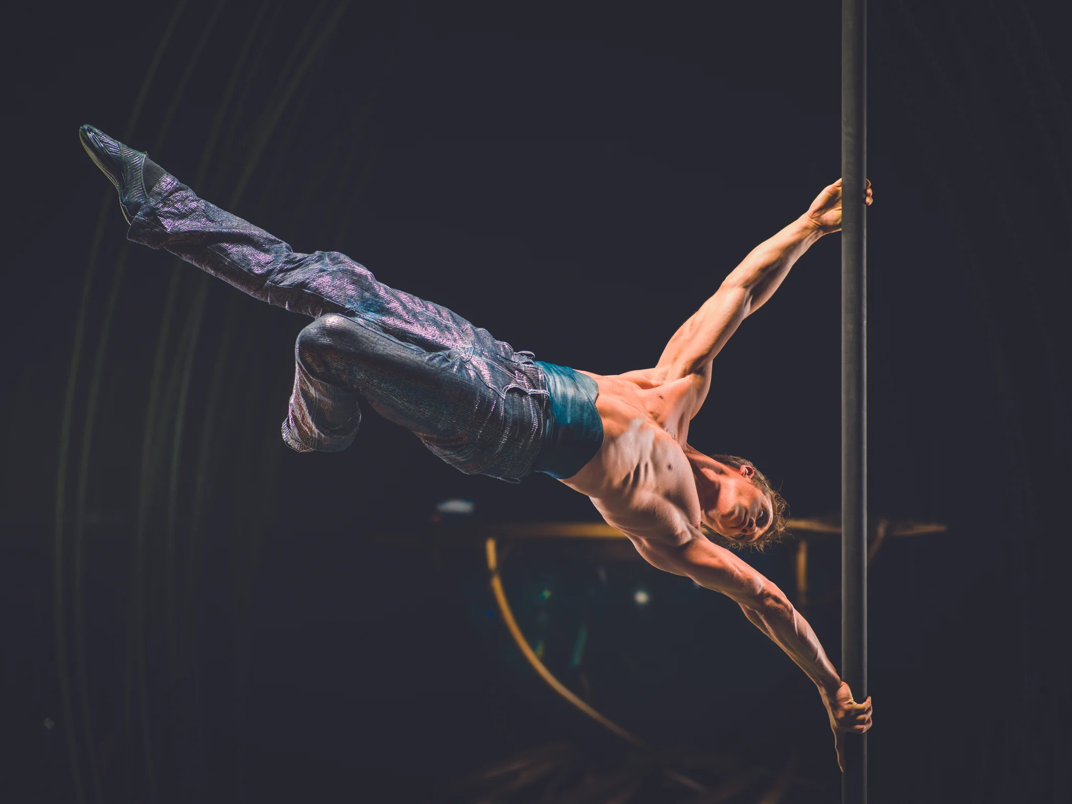 A performer demonstrates extreme athletic ability during a Cirque du Soleil performance, the kind of athletic ability that elite gymnasts have honed through years of competition.&nbsp;Image supplied by Cirque du Soleil.&nbsp;&nbsp;