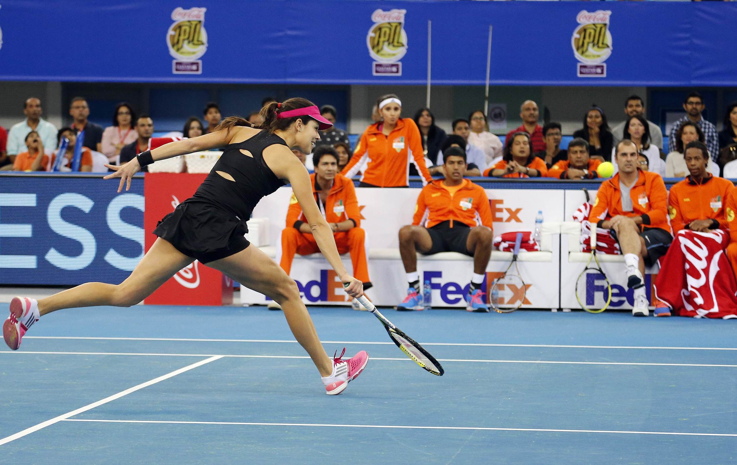 Indian Aces' Ana Ivanovic of Serbia hits a return UAE Royals' Kristina Mladenovic of France during their match at the International Premier Tennis League (IPTL) in Dubai December 13, 2014. Image supplied by Action Images /&nbsp;Ahmed Jadallah