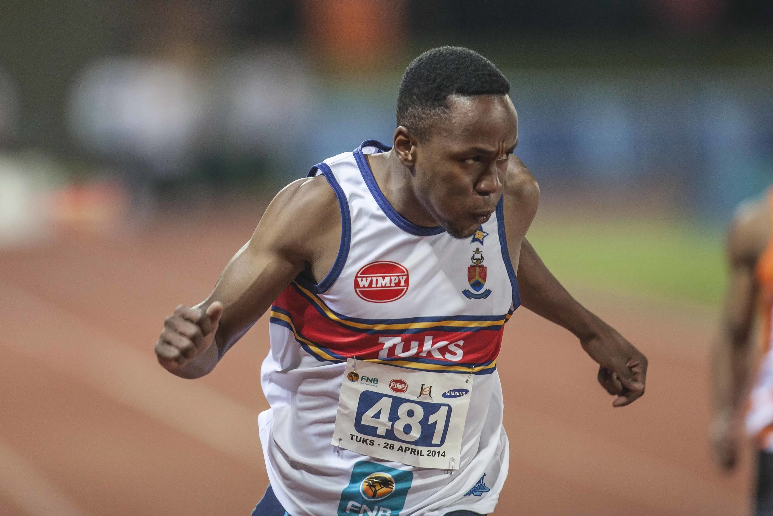 Akani Simbine crosses the line for Tuks. The athletics program at Tuks is one of the best in the country. Their athletes have won both Varsity Athletics and USSA for two consecutive years. Image supplied by Tuks Sport.