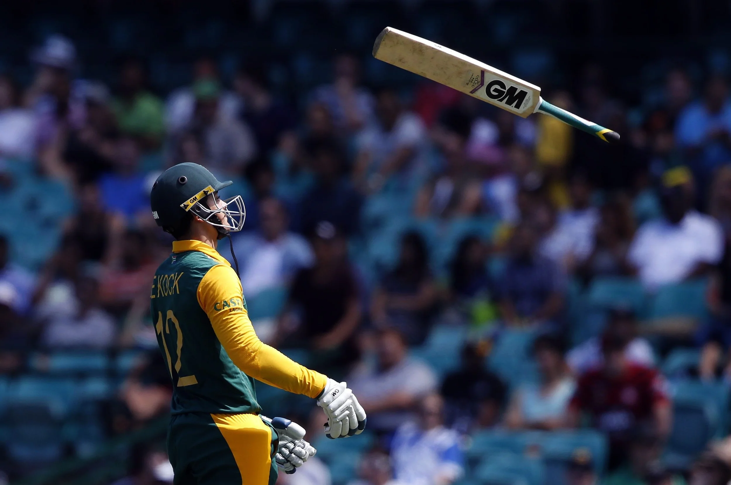 Quinton de Kock throws his bat as he walks off the field after being dismissed by West Indies bowler Jason Holder for twelve runs during the Cricket World Cup match at the Sydney Cricket Ground (SCG). Image suplied by Action Images/ Jason Reed.