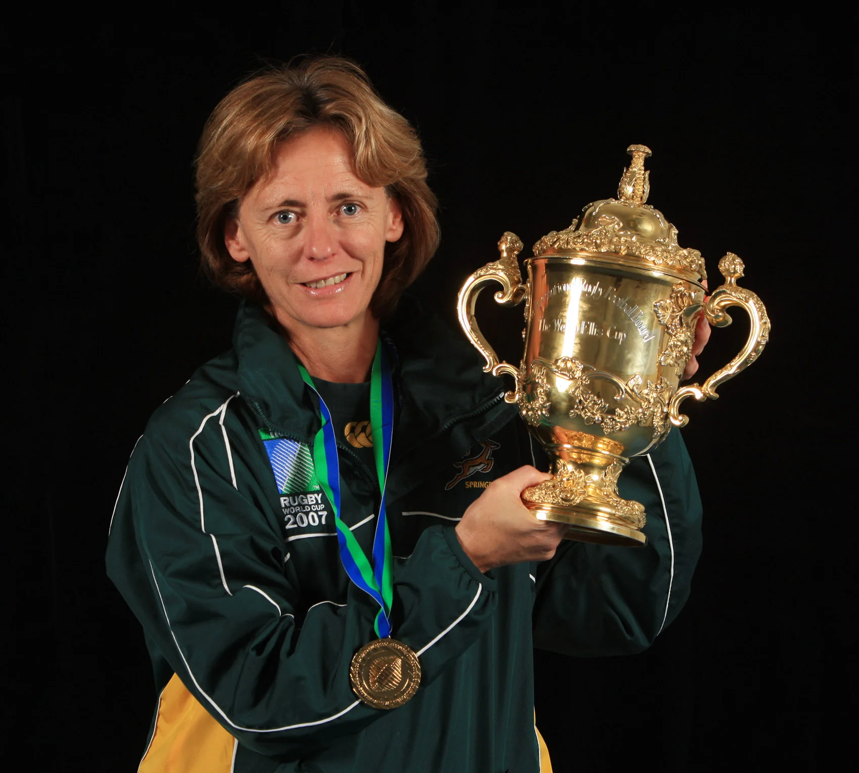 Dr Sherylle Calder, founder and owner of EyeGym, with the William Webb Ellis Cup, the trophy awarded to the Rugby World Cup winners, in 2007. It was the second time she lifted the famous trophy after previously winning it with England in 2003. Image supplied by EyeGym. 