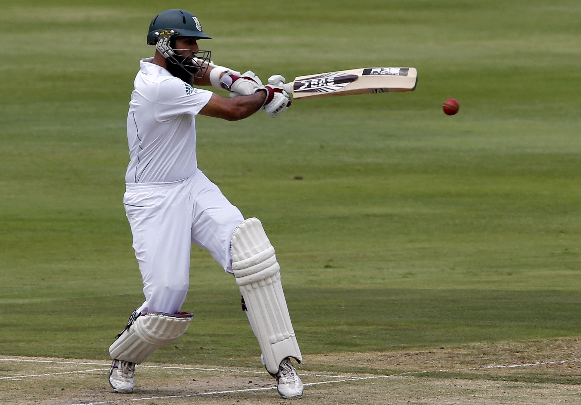 Image supplied by Actions Images/ Mike Hutchings. Hashim Amla, South Africa's Test cricket captain, pulls a short ball against Pakistan in the first Test in Johannesburg, in 2013. Image supplied by Actions Images/ Mike Hutchings. 