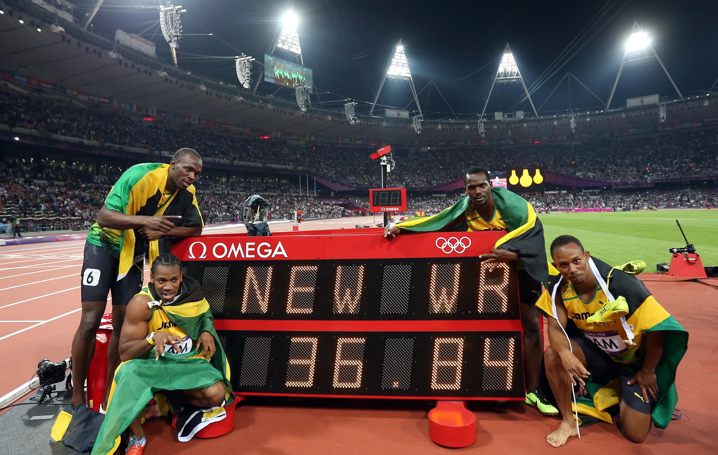 Usain Bolt, Yohan Blake, Nesta Carter, and Michael Frater (from L to R) of Jamaica celebrate after the men's 4x100m relay final at London 2012 Olympic Games. The Jamaican team won gold medal with a new world record of 36.84. Image Supplied by Action Images / Liao Yujie