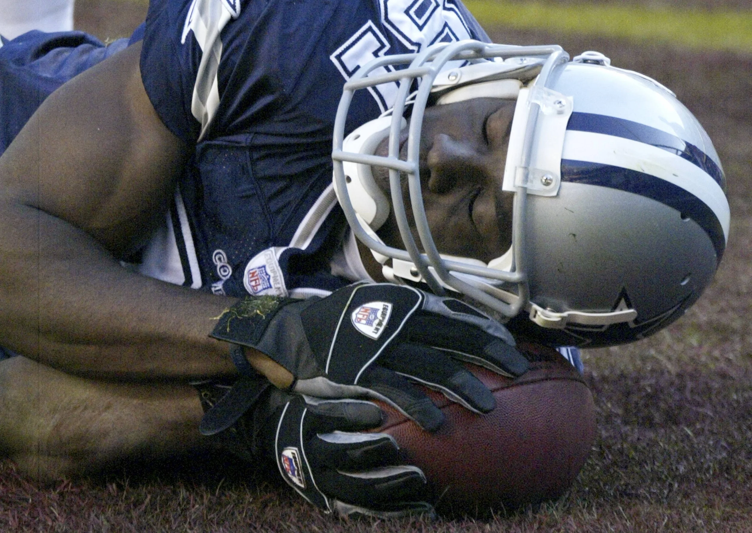 Former Dallas Cowboys receiver Terrell Owens pretends to sleep on the ball after scoring a third-quarter touchdown against the Washington Redskins in their National Football League game in Landover, Maryland November 5, 2006. Owens, who has faced criticism for reportedly falling asleep in team meetings, was penalized for the celebration. Image sipplied by Action Images/ Andrew Cameron