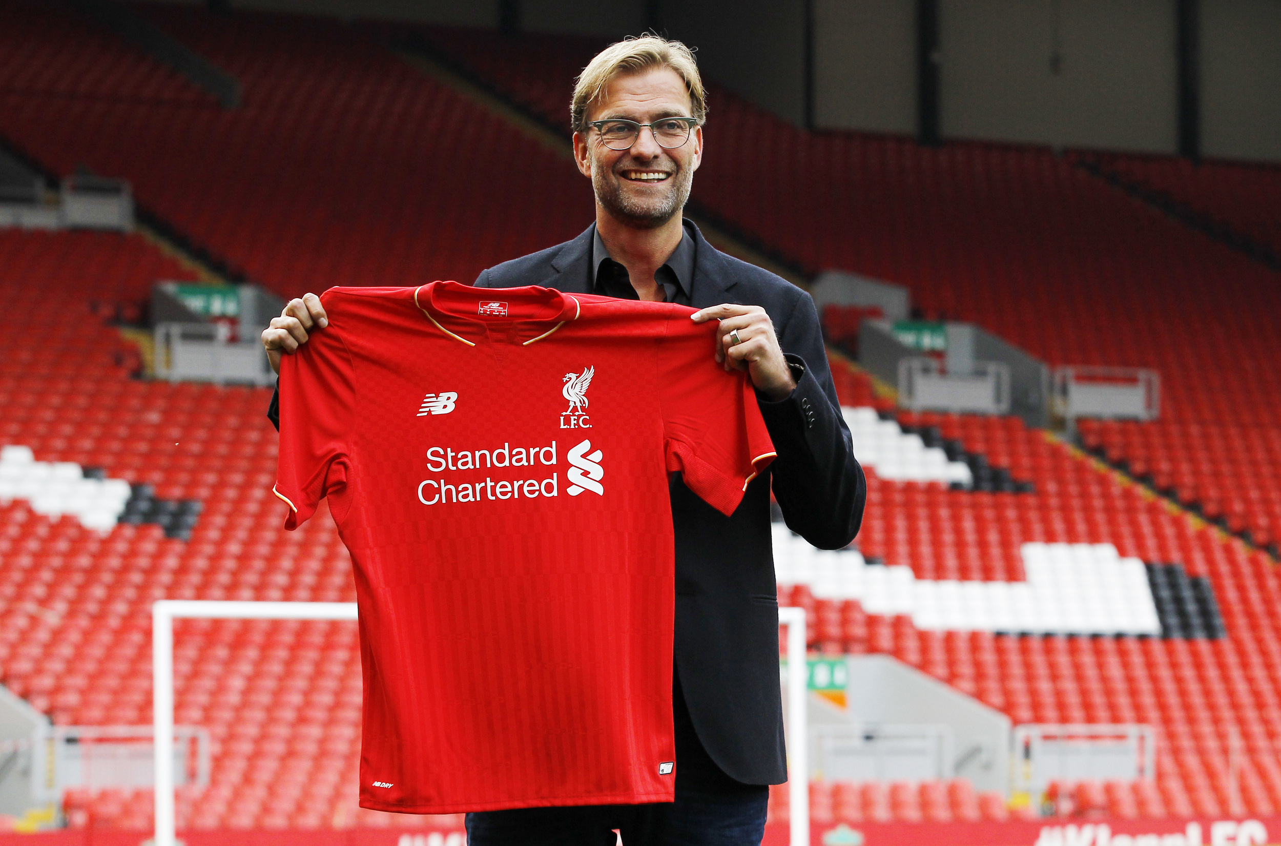 New Liverpool manager Jürgen Klopp poses after the press conference. He comes to Anfield with a weight of expectation and faces a difficult challenge as the new manager of a prominent club. Image supplied by Action Images / Craig Brough.