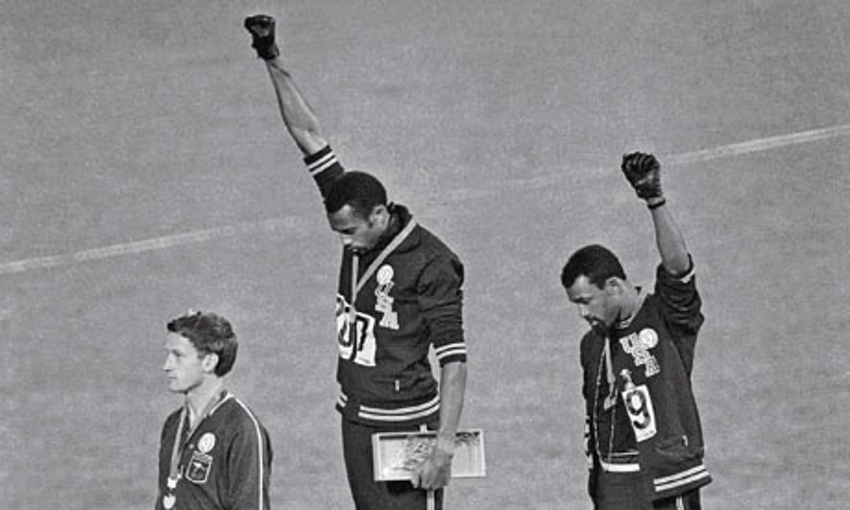 At the 1968 Olympic Games in Mexico City, John Carlos (right), Tommie Smith (centre) and Peter Norman, who wore an Olympic Project for Human Rights badge in support of their gesture. 