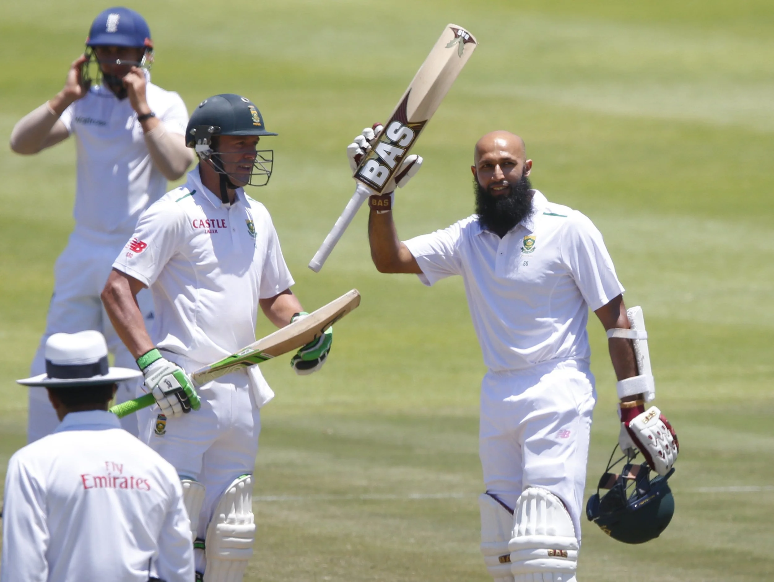 Hashim Amla (r) celebrates scoring a hundred against England while AB de Villiers applauds. de Villiers replaces Amla as South Africa's Test captain. Image supplied by Action Images / Mike Hutchings.