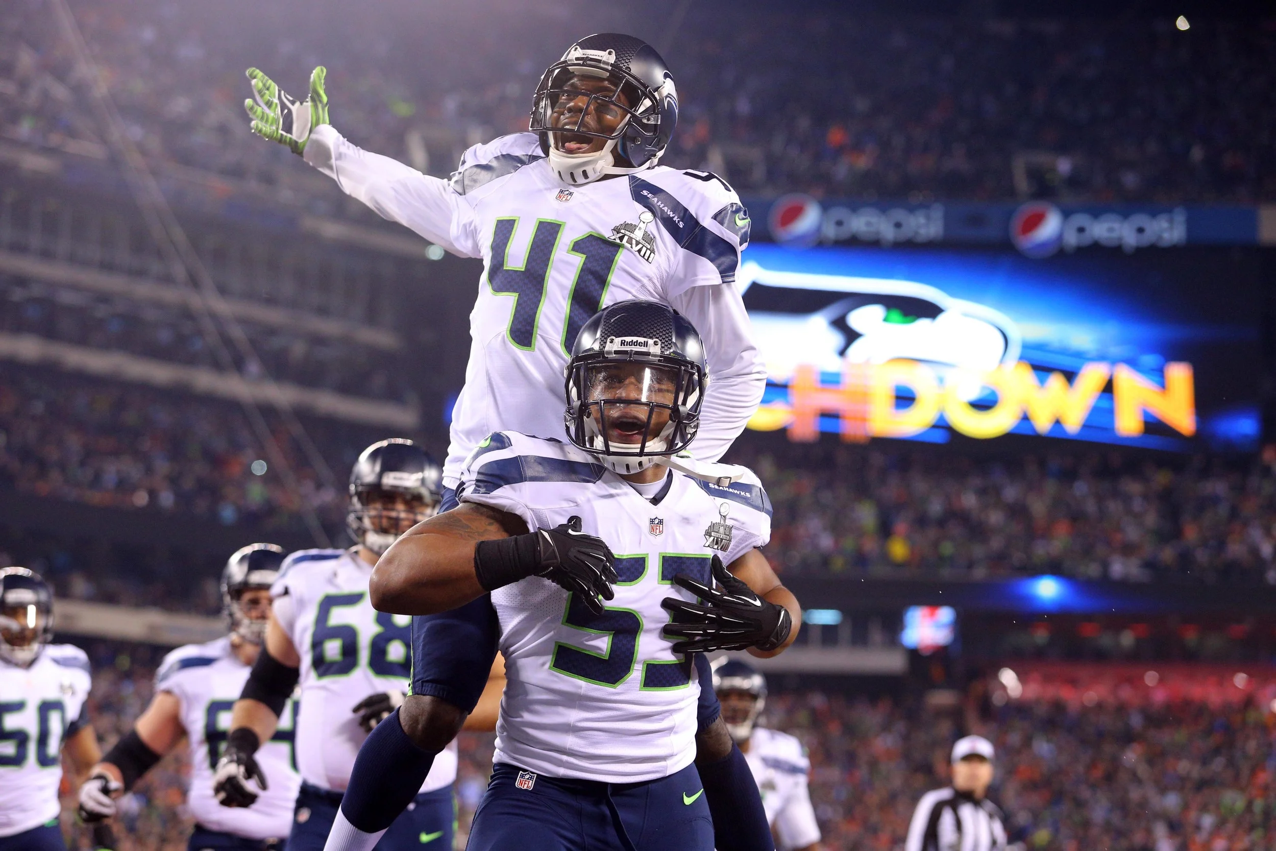 Seattle Seahawks players celebrate a touchdown infront of another sell-out crowd. The franchise is unrivalled in the NFL when it comes to fan engagement and has translated passionate support into on-field success. Image supplied by Action Images.