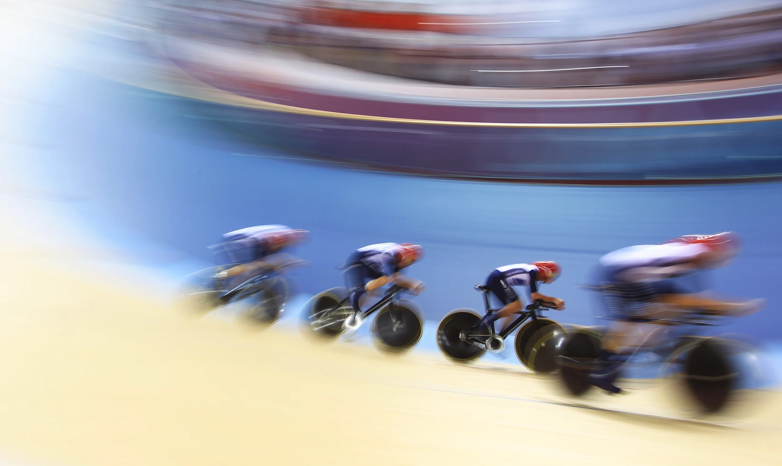 Great British Cycling Team's men's team pursuit in action at the London 2012 Olympic Games. GBCT would go on to win 8 golds for the second consecutive Games. Image supplied by Action Images / Jason O'Brien .
