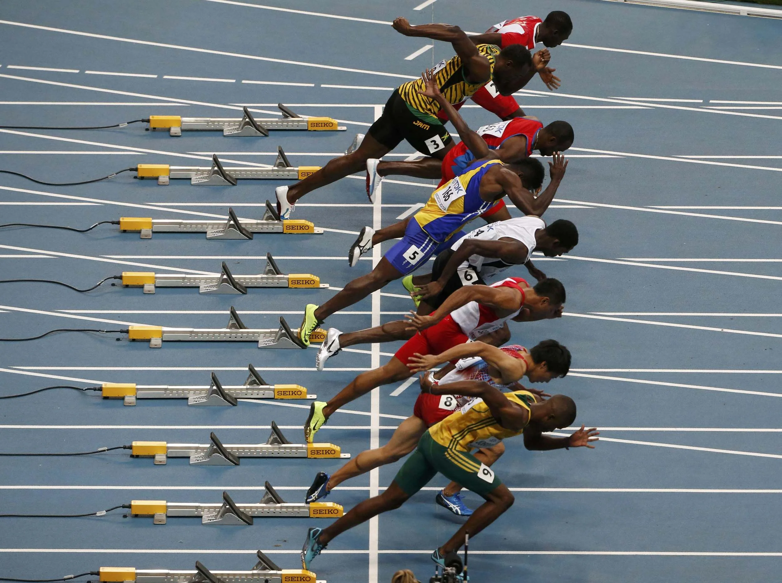 8 of the world's fastest men, including Usain Bolt (2nd from top) leave the starting blocks in a heat during the IAAF World Athletic Championships at the Luzhniki stadium in Moscow, August 10, 2013. Images supplied by Action Images / Maxim Shemetov.
