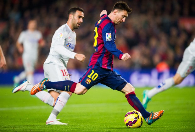 Lionel Messi takes aim with his right foot.