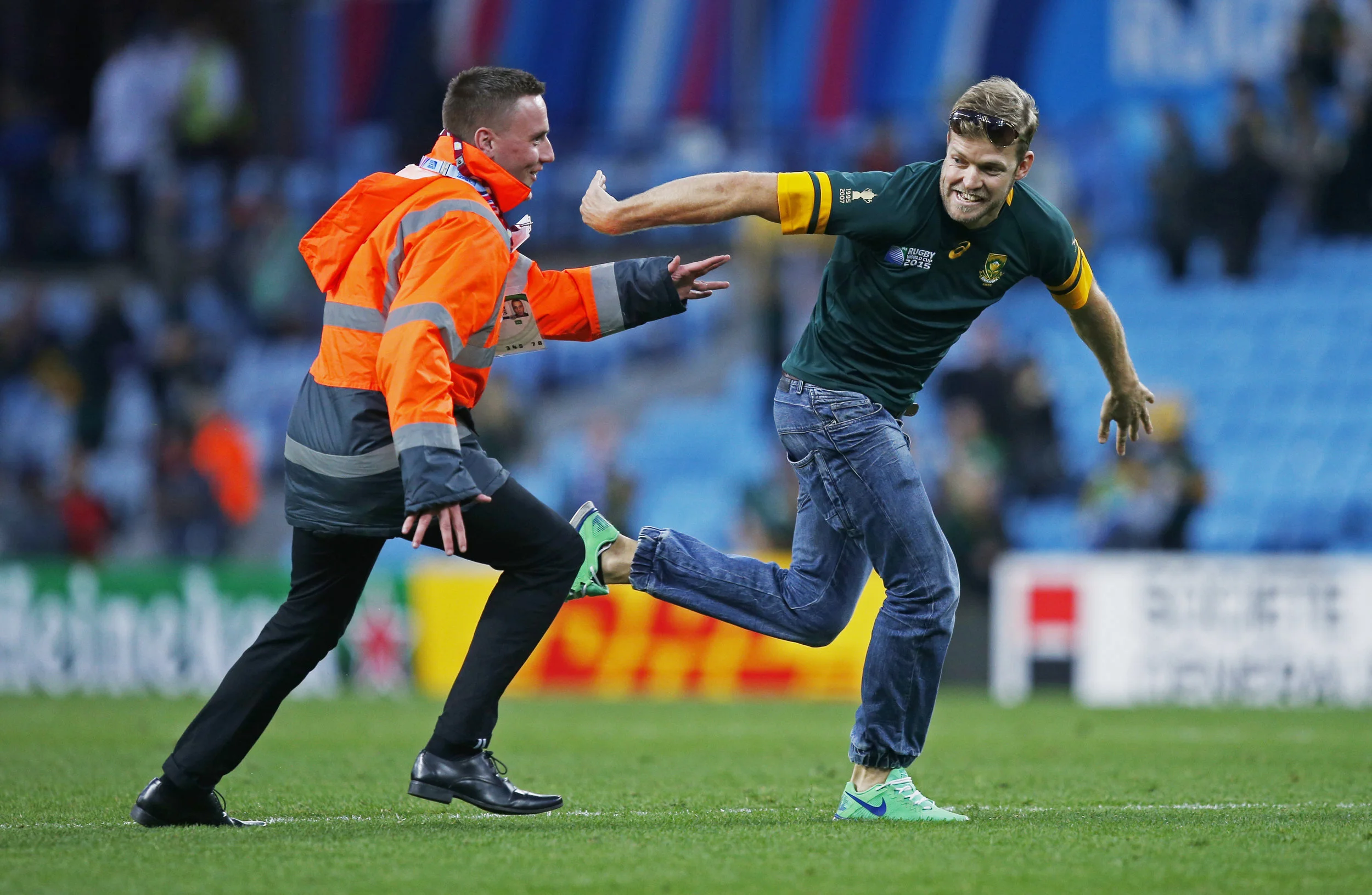 A South African rugby fan invades the pitch during his nation's 2015 World Cup clash with Samoa at Villa Park, Birmingham England. Image supplied by Action Images / Peter Cziborra.