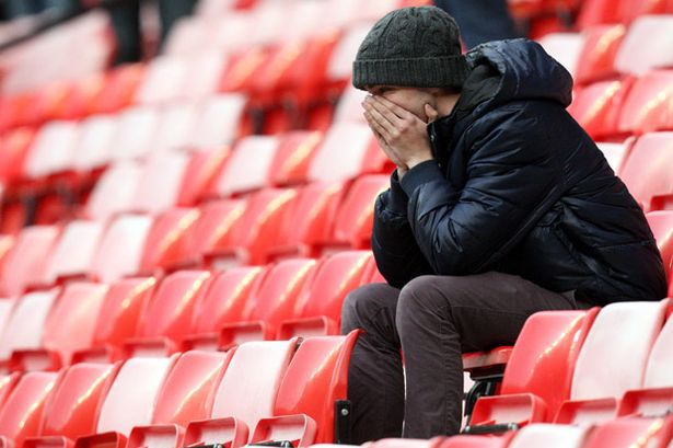 A Manchester United fan looks on with disbelief after his side lost 2-1 to AFC Bournemouth at home last season. 