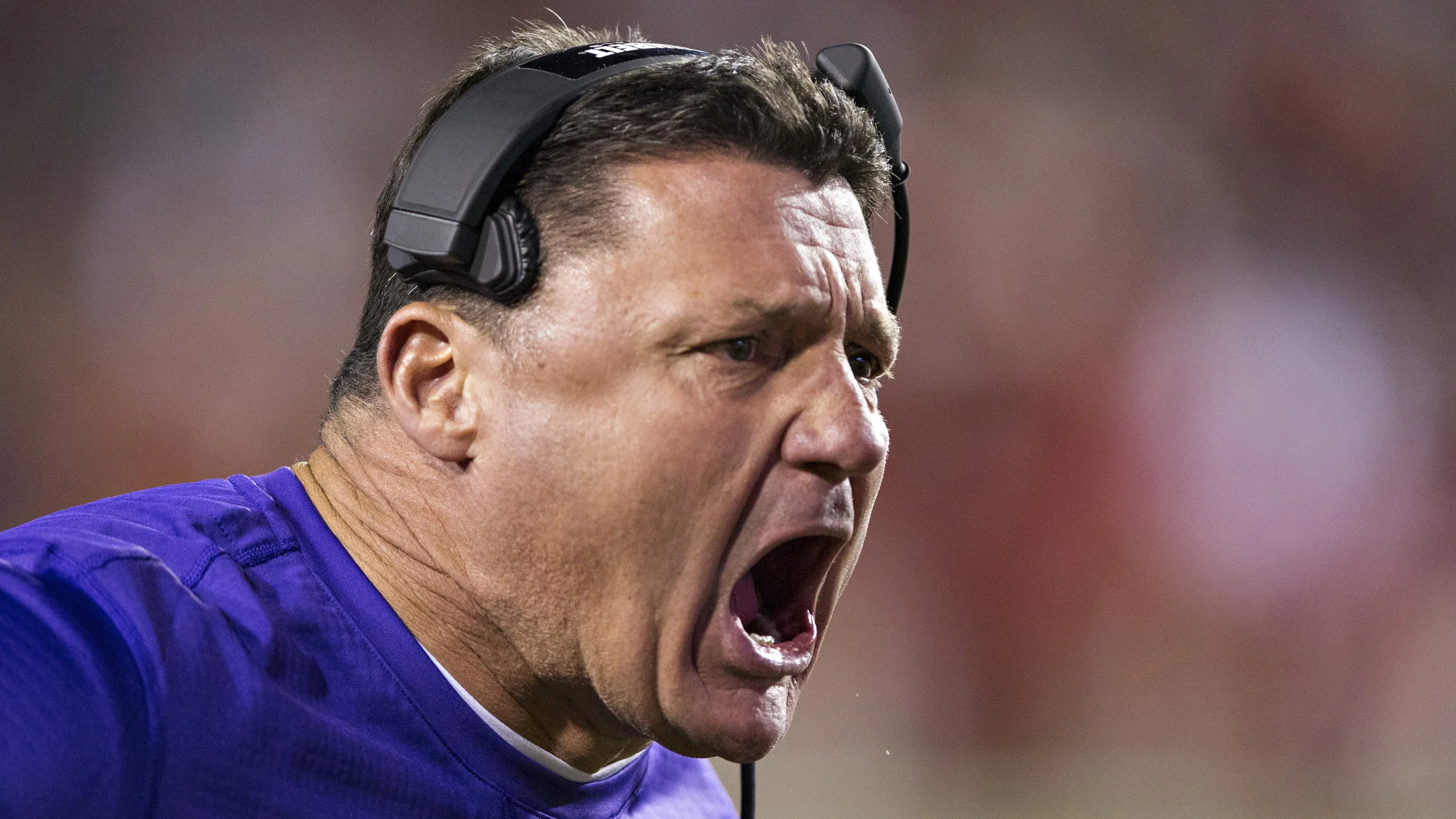 Ed Orgeron, head coach of Louisiana State University's football team, gets stuck into his players during a game.