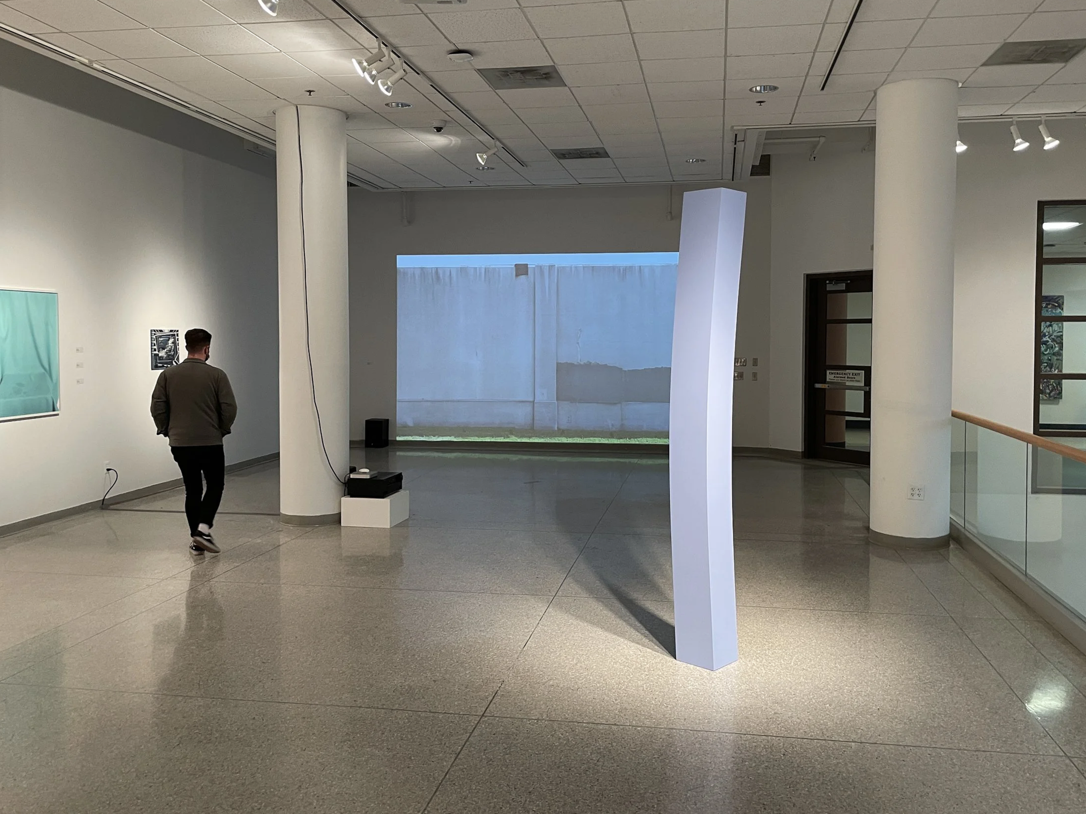   Lodestone , 2022. Enamel on shaped wood. 96 x 9 x 9 inches. Elaine L. Jacob Gallery, Detroit, MI, Second Life Exhibition.  The column appears straight and structurally sound from certain viewpoints, yet visibly bent and compressed from others, sugg
