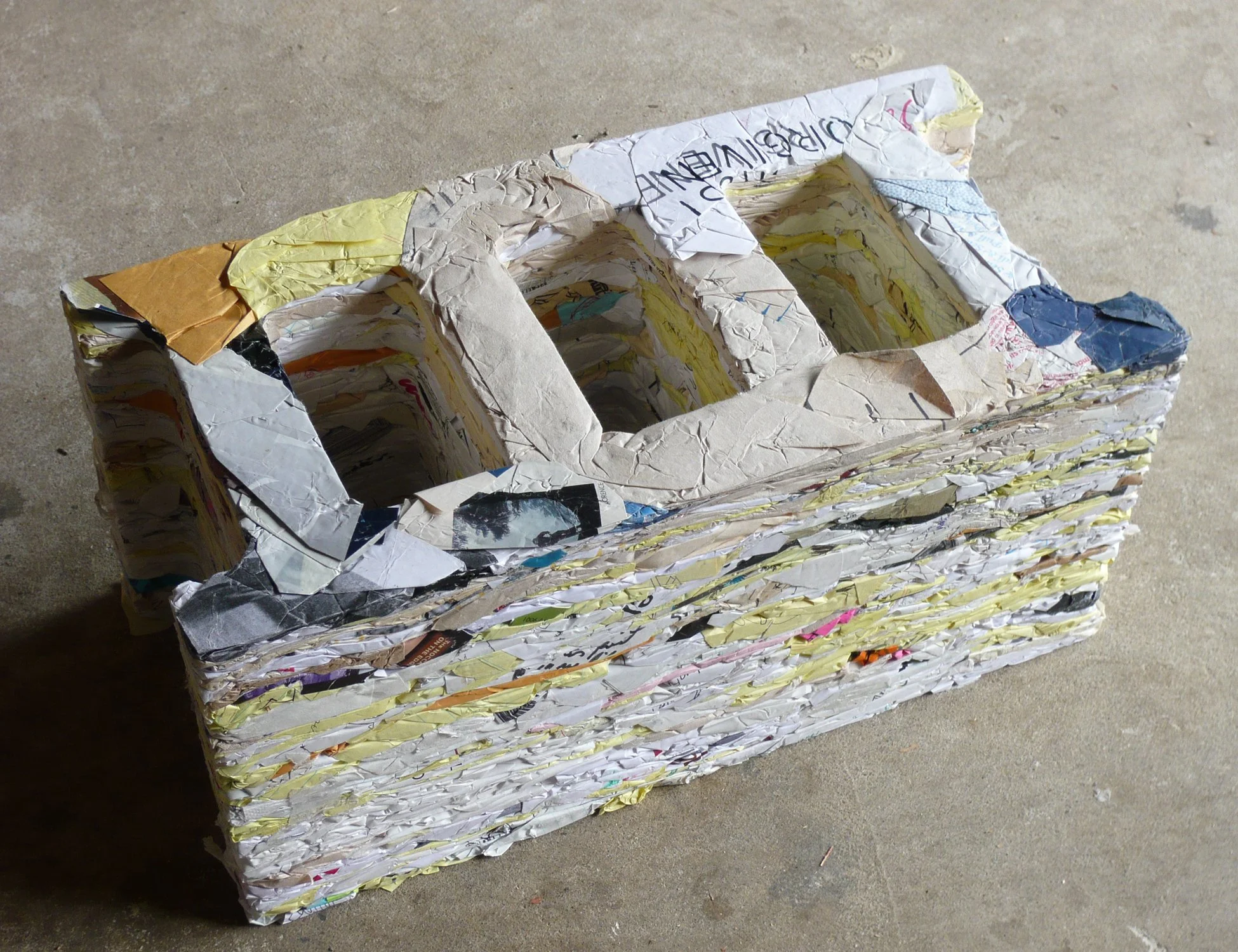 Building Material , 2009. Repurposed notebooks and PVA glue. 7.5 × 15 × 7.5 inches. Five years of notebooks were cannibalized and compressed into the familiar form of a cinder block, transforming accumulated thoughts, observations, and ideas into