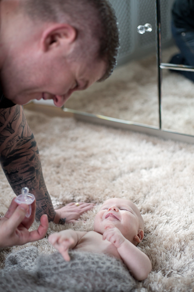 baby girl smiling up at dad