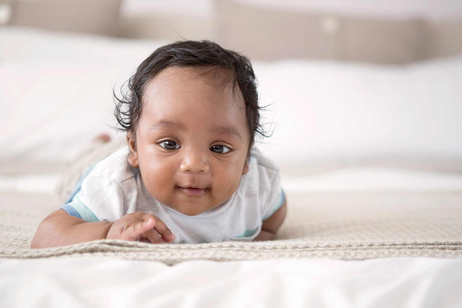 baby boy looking into camera - lifestyle photography at home