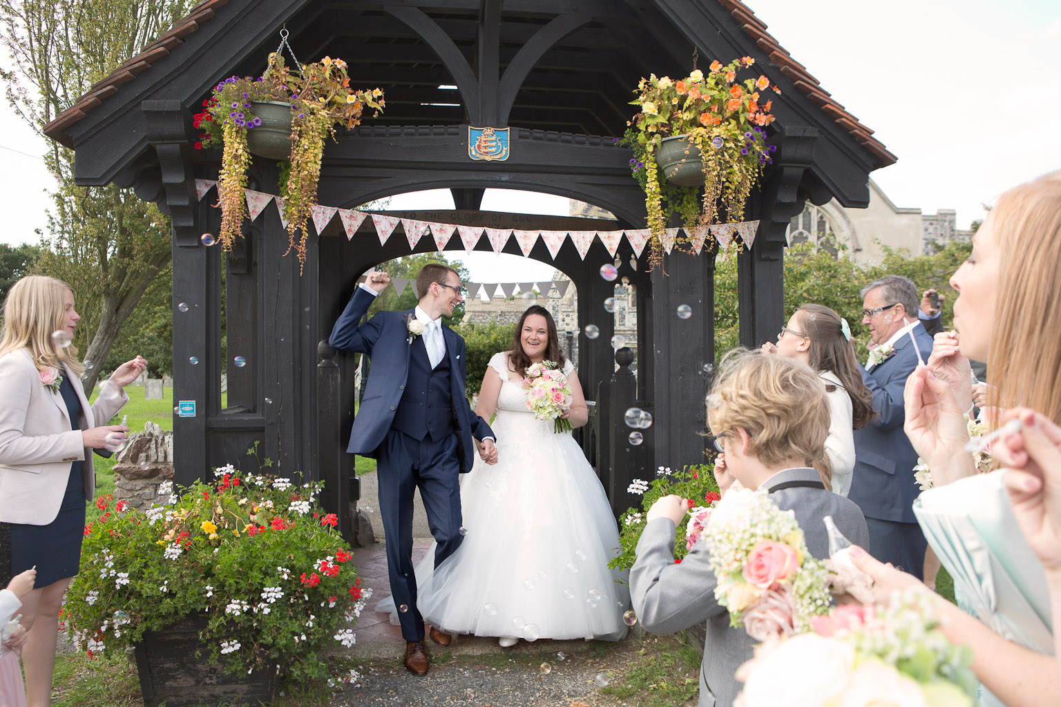 bride and groom with confetti bubbles