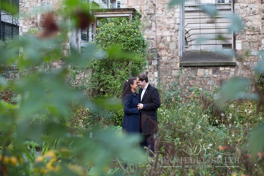 couple nuzzling at engagement photography session london