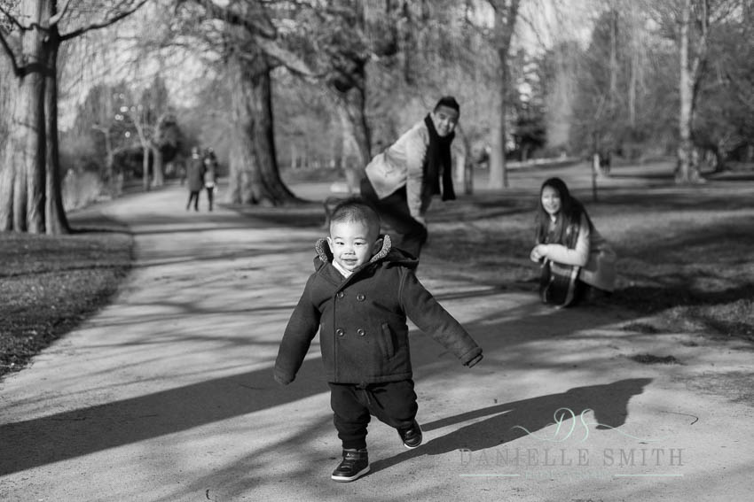 little boy running in park