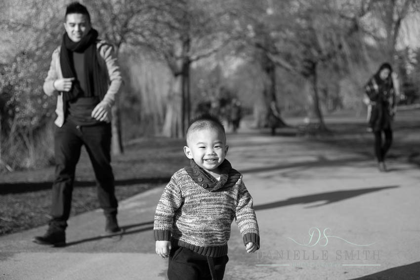 little boy smiling in park